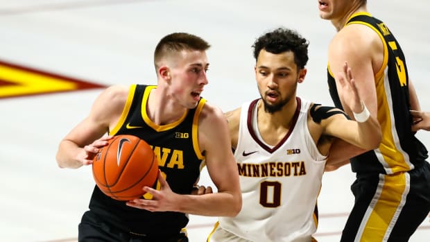 Feb 16, 2020; Minneapolis, Minnesota, USA; Minnesota Golden Gophers guard Brady Rudrud (10) drives to the basket against Minnesota Golden Gophers guard Payton Willis (0) in the second half at Williams Arena. Mandatory Credit: David Berding-USA TODAY Sports